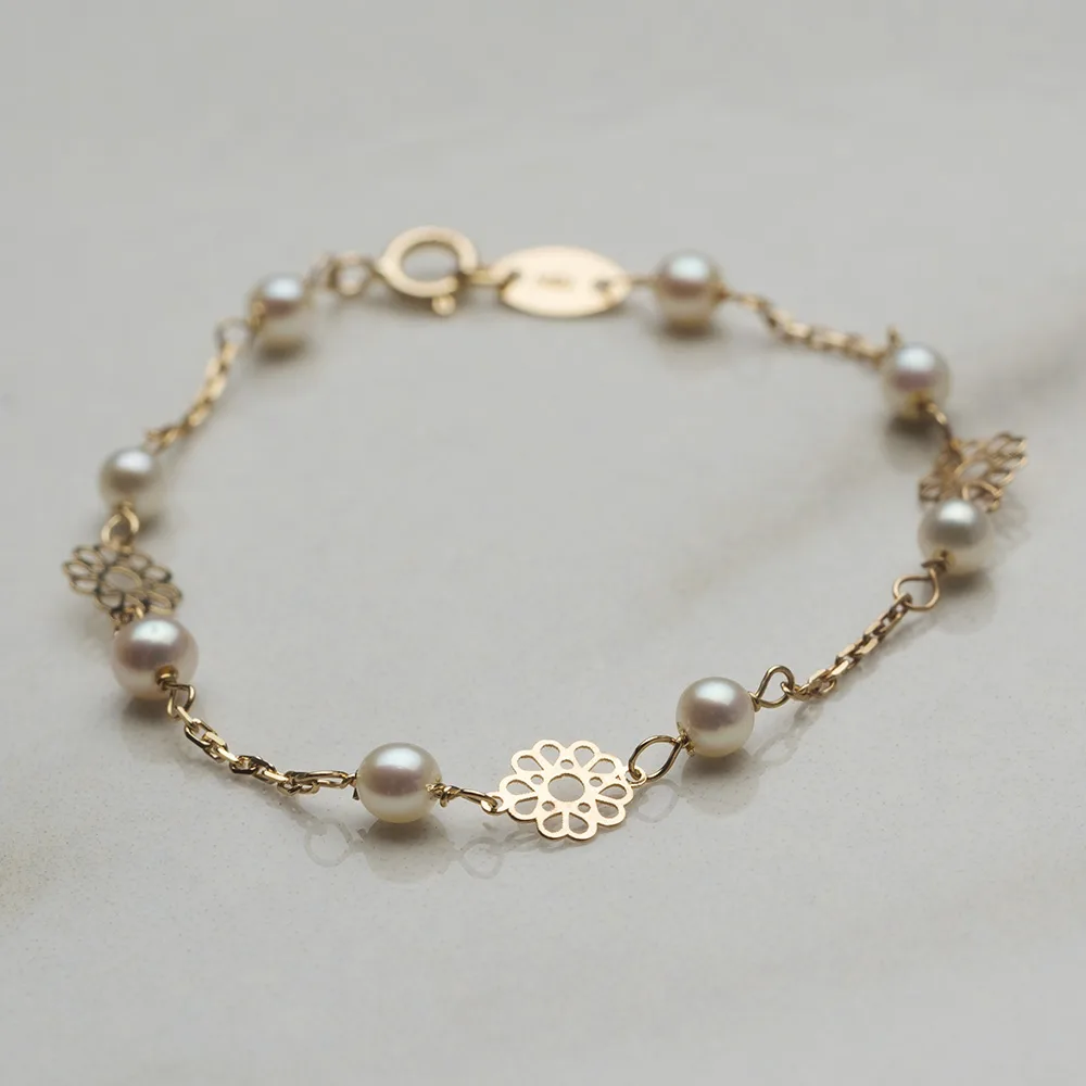 Baby jewelry in 18k gold with pearls — Joyería Liévano